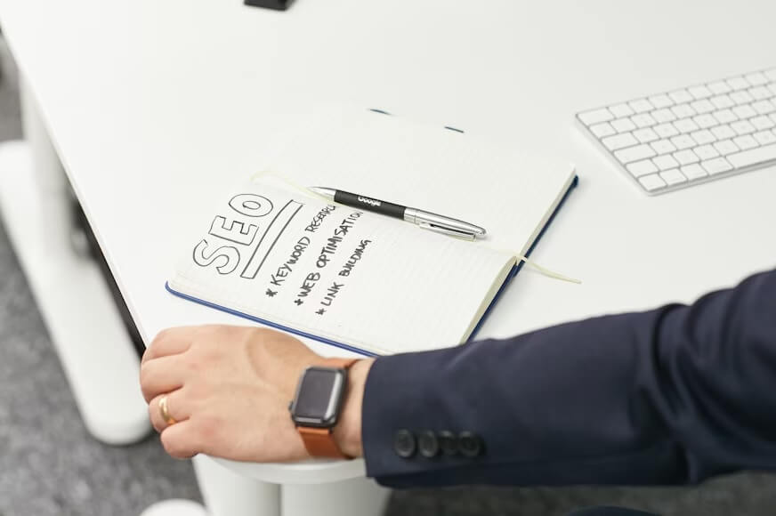 An open book with the word SEO designed in it.